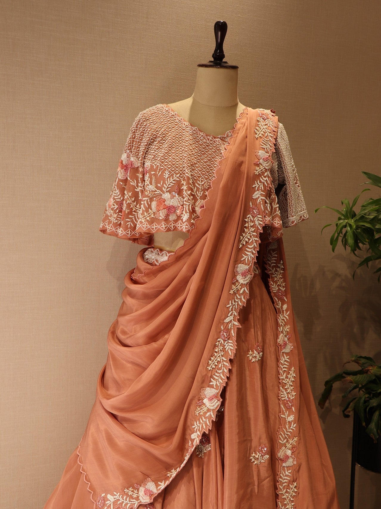 Peach cape drape lehenga set