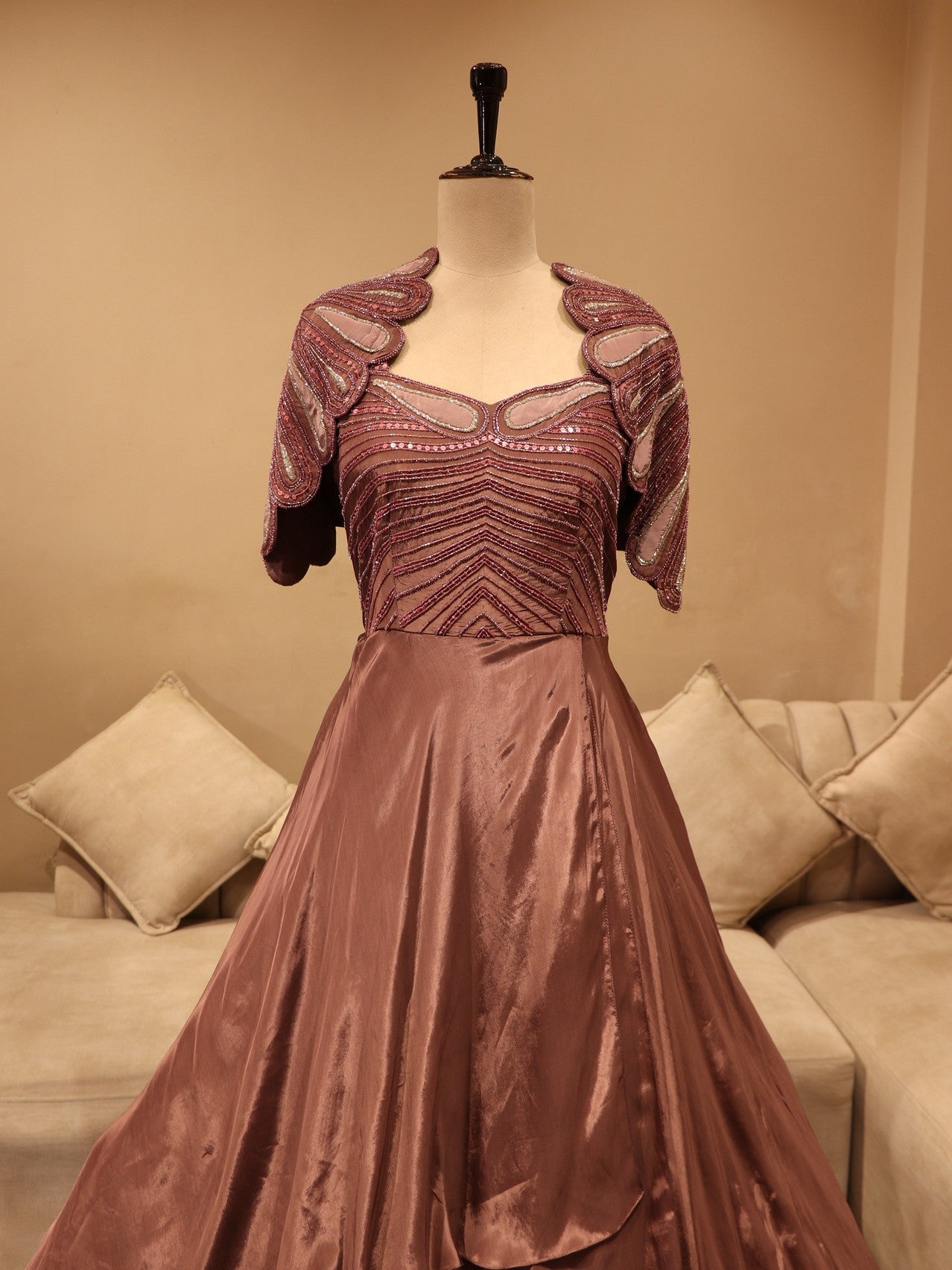 Mauve embroidered cape sleevs gown