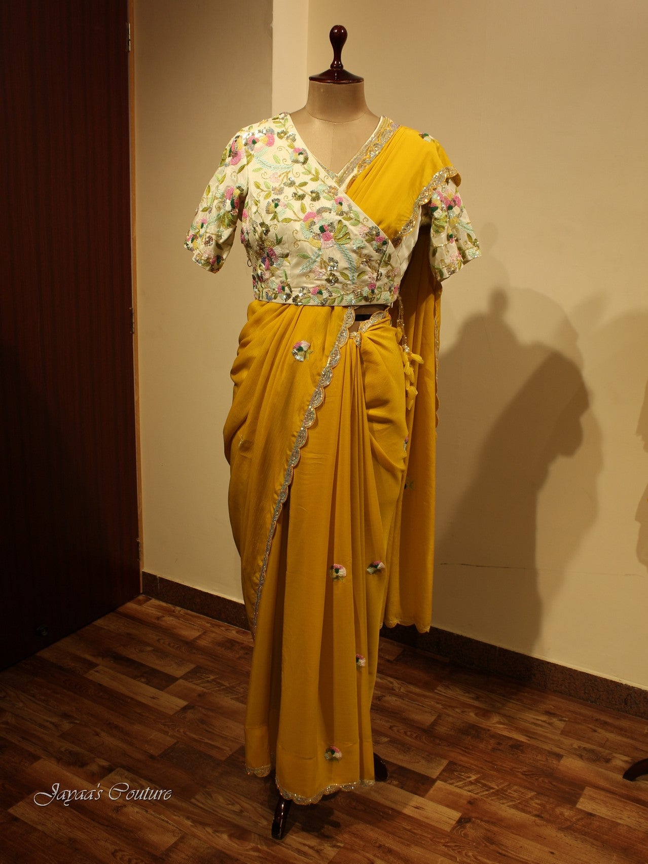 Yellow saree with off white blouse