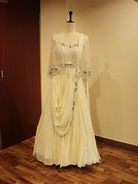 Off white lehenga with cape