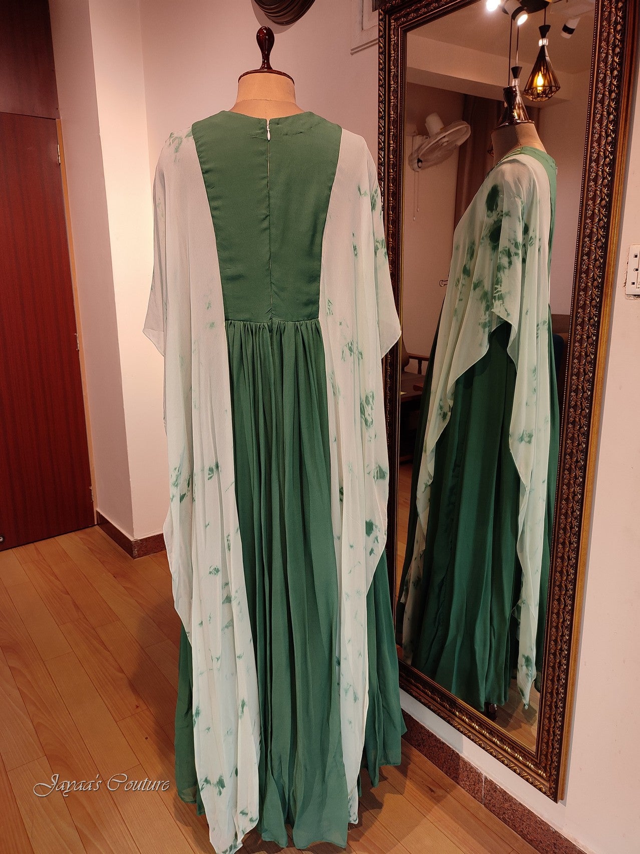 Green gown with toe and dye drape sleeves