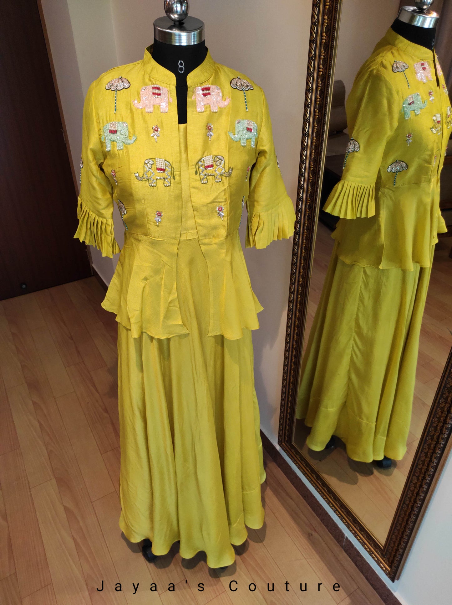 Greenish yellow gown with peplum jacket