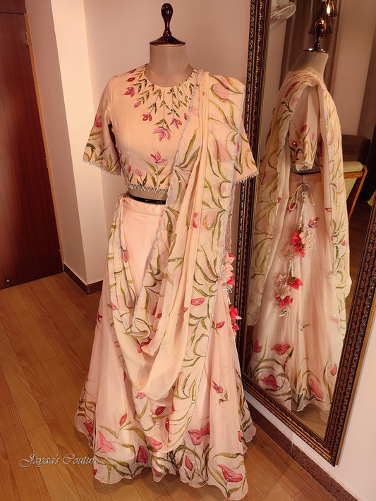 Beige hand painted skirt with blouse & dupatta.