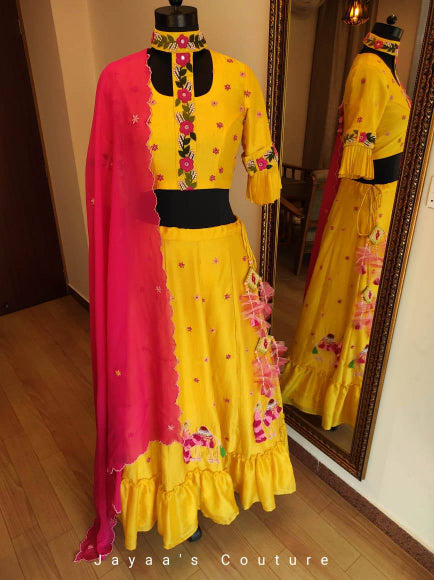 Yellow lehenga blouse and dark pink dupatta