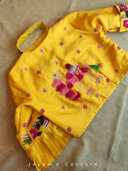 Yellow lehenga blouse and dark pink dupatta