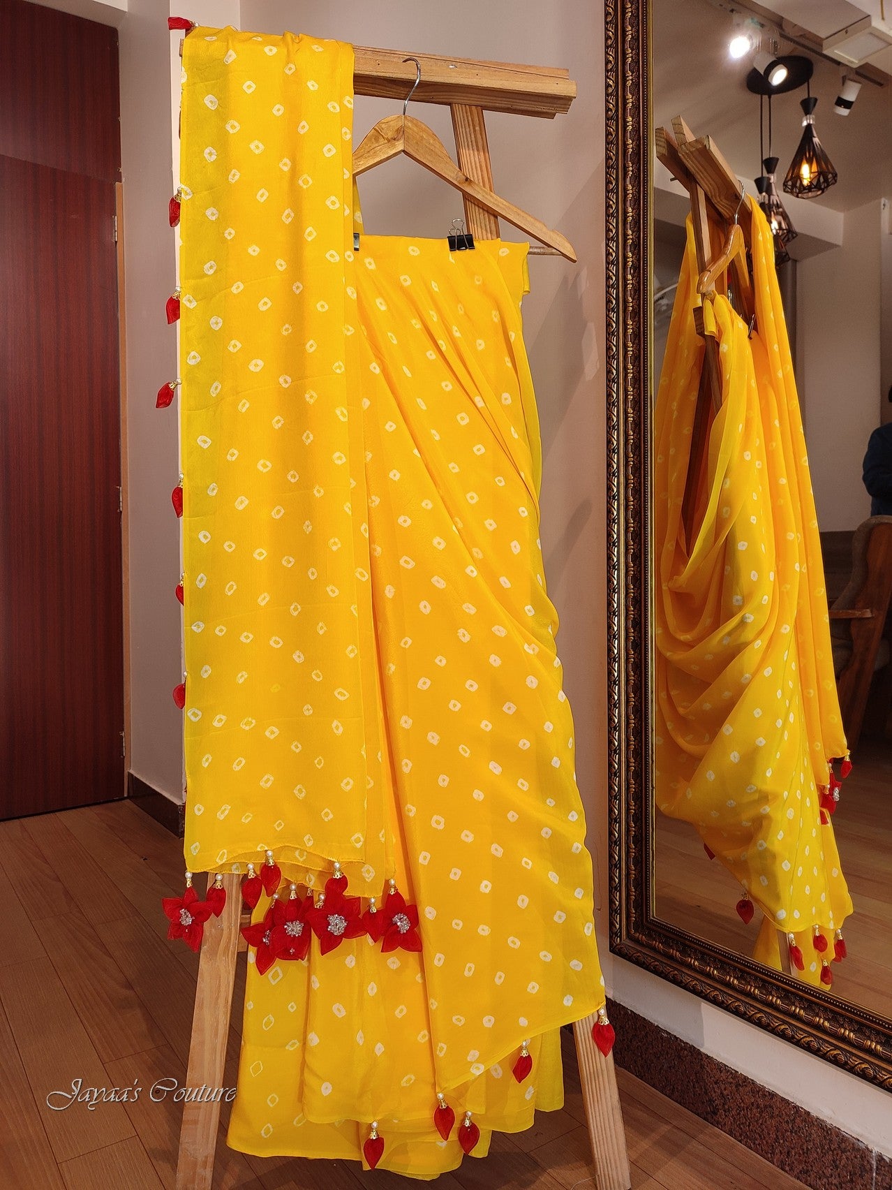 Yellow bandhej saree with rani blouse