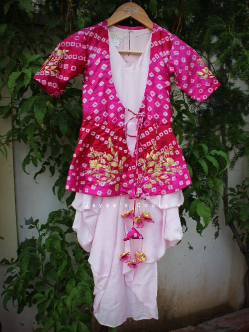 Pink dhoti draped dress with bandhani peplum style jacket.
