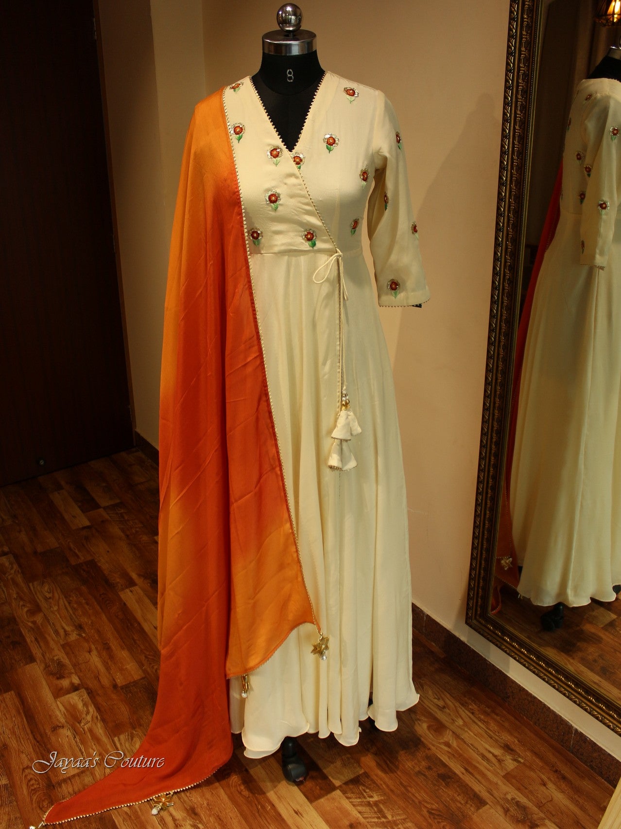 Off white gown with red orange shaded dupatta