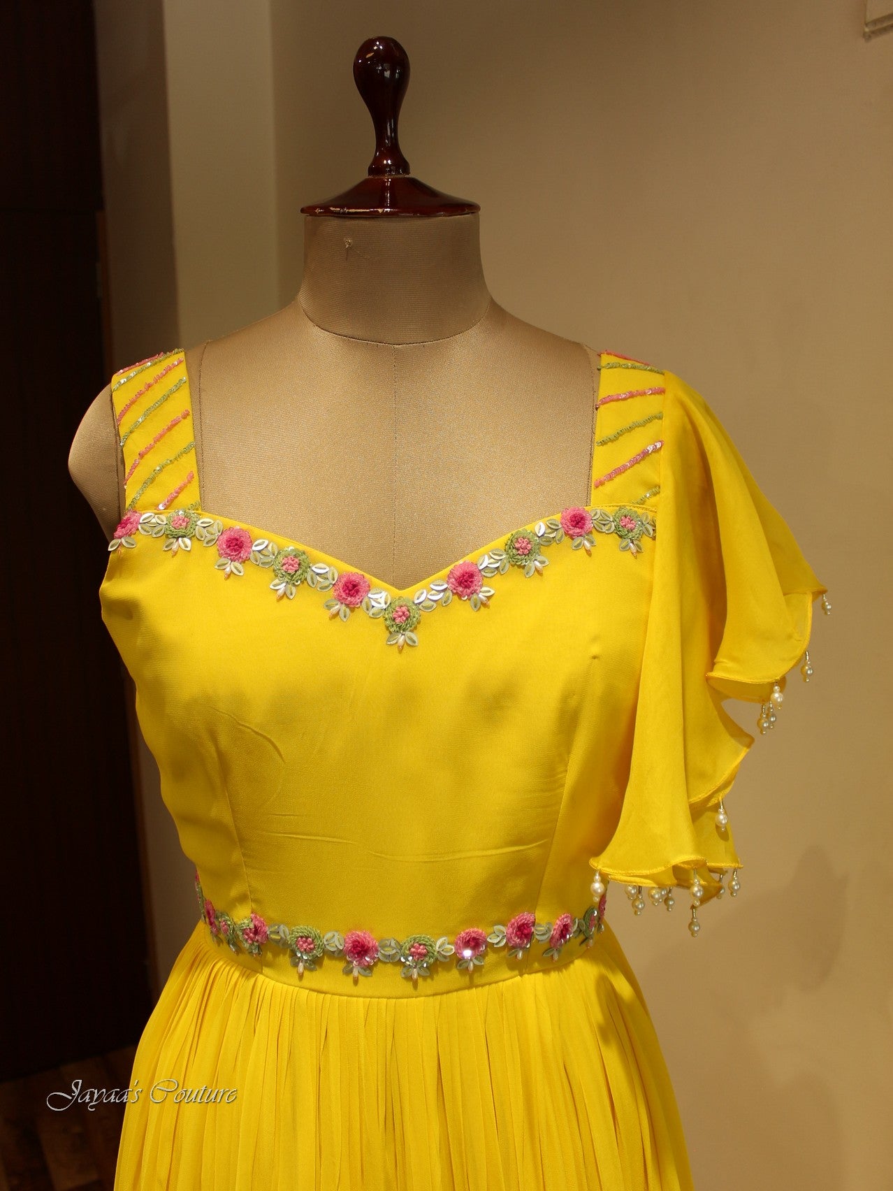 Yellow gown with flaired sleeves