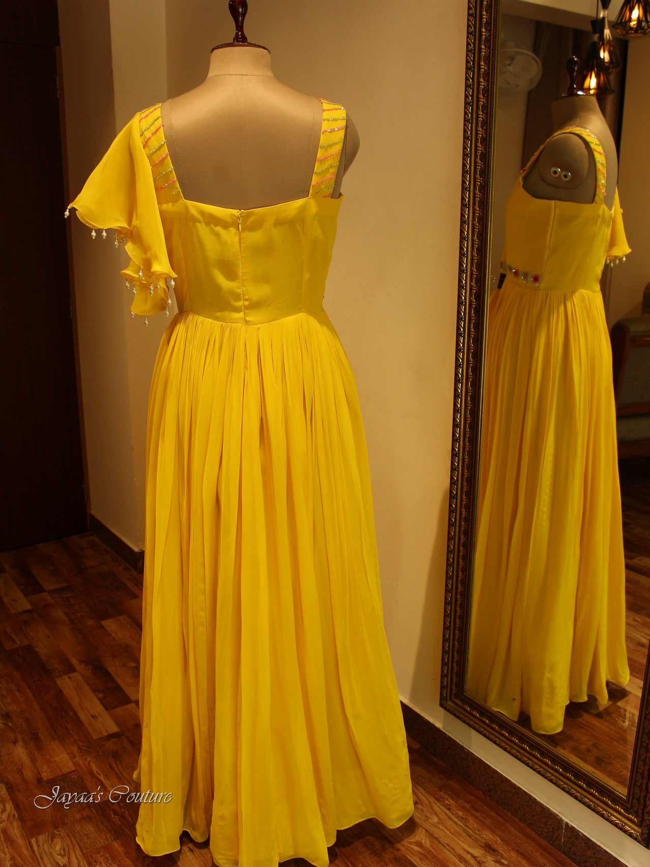 Yellow gown with flaired sleeves